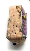 A Collection Vintage Pin Cushions and Needle Holders